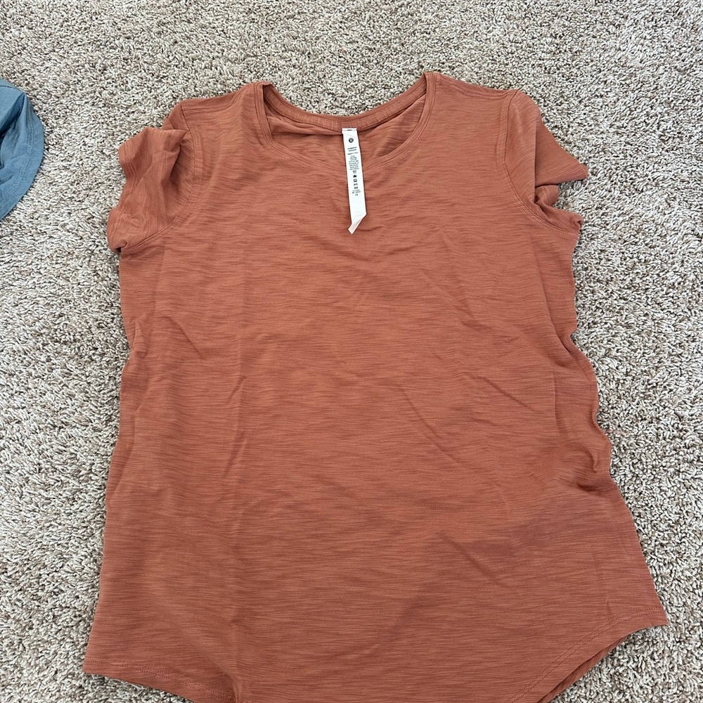 Lululemon Athletica Ruffled Orange Short Sleeve Top